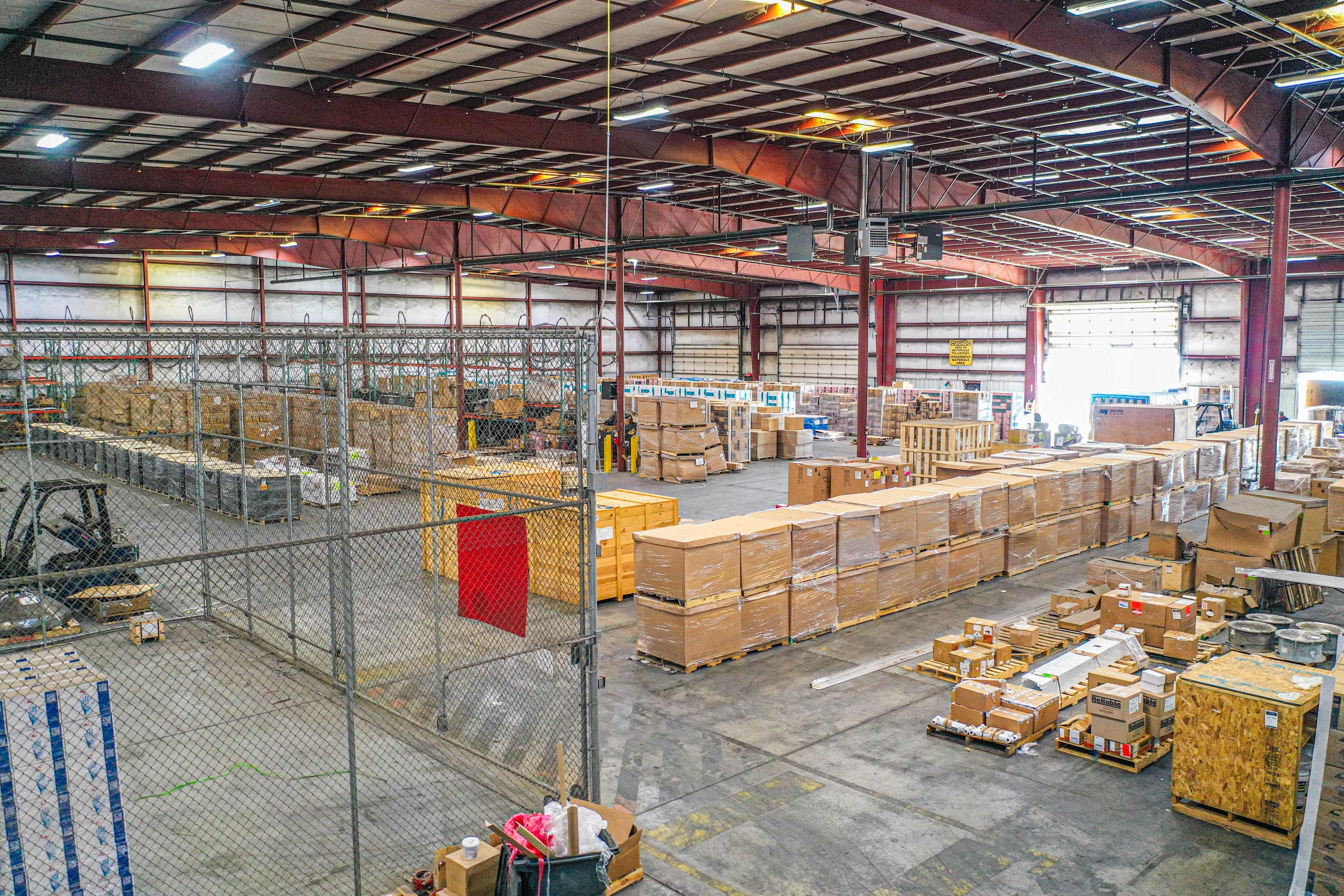 Aerial drone view of warehouse complex showing final comprehensive facility overview